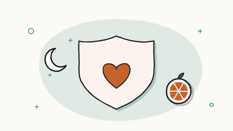 Escudo con un corazón, una naranja partida y una luna